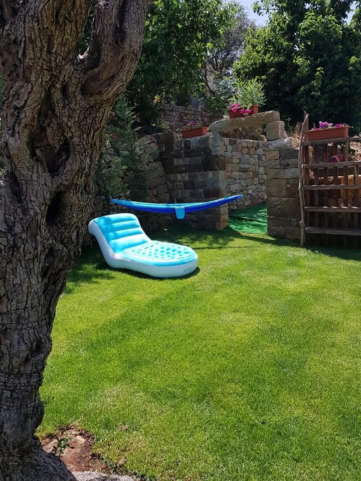 Shaded corner with a hammock under the olive tree